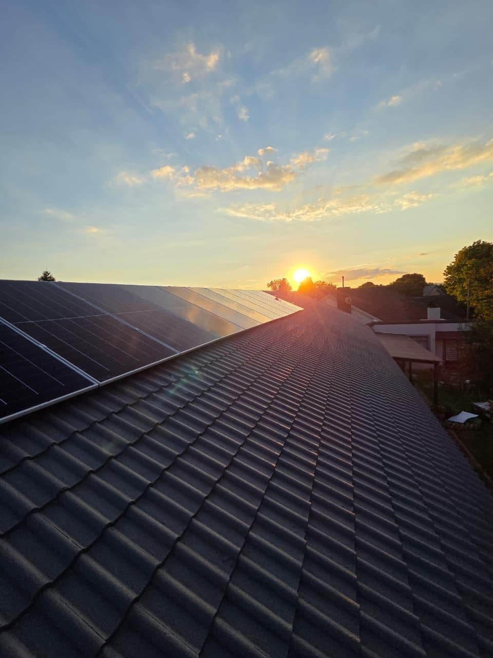 Solar panels at sunset on a Garden Route roof, installed by Sky Projects